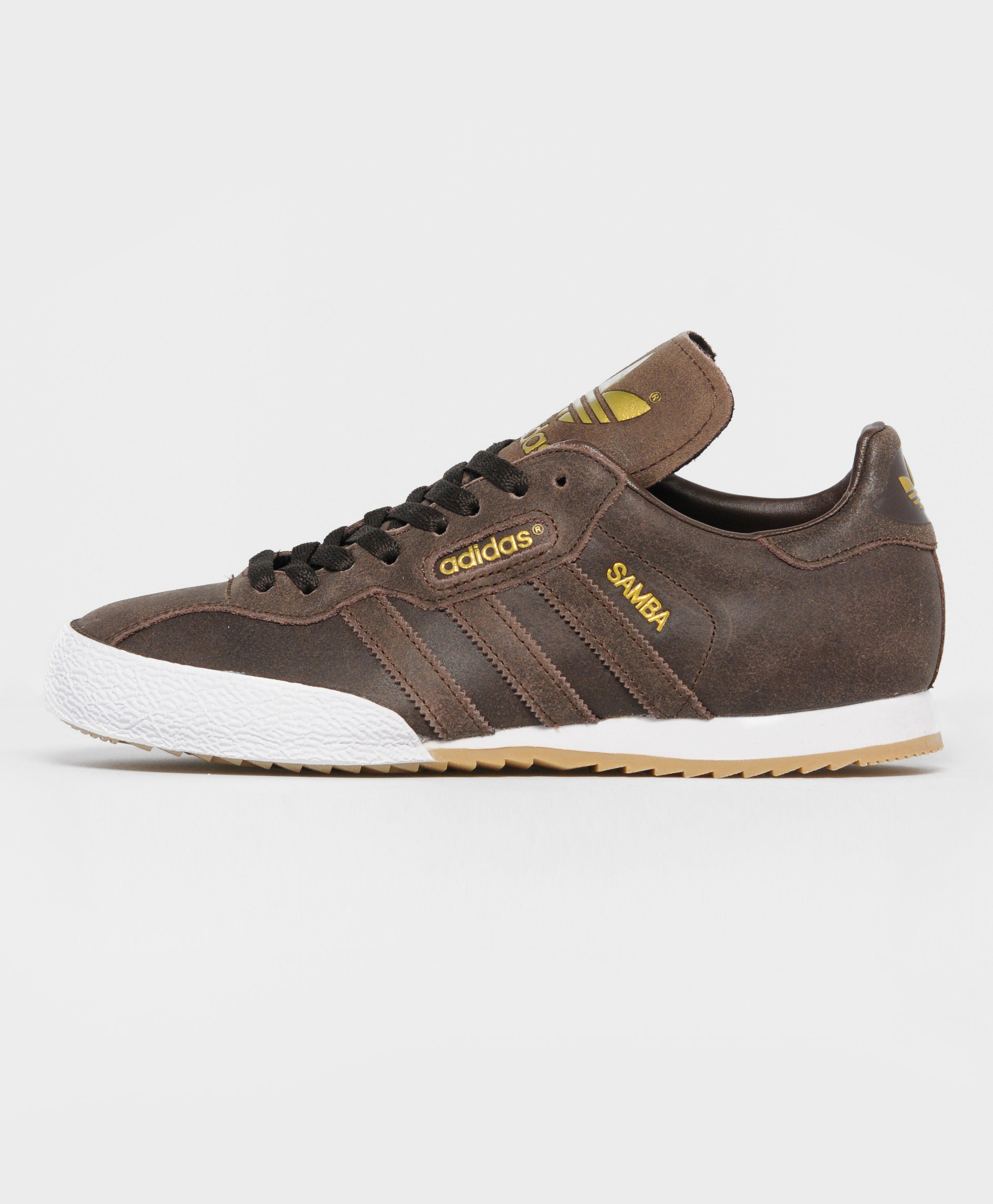 brown adidas samba trainers