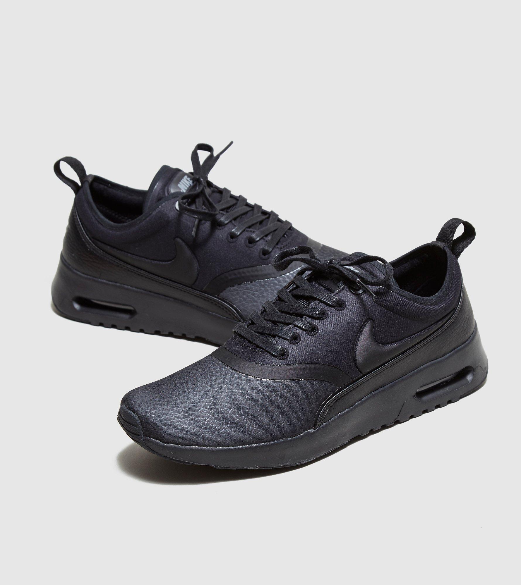 nike thea black leather