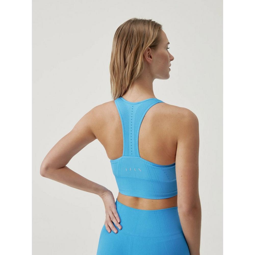 Born Living Yoga AMAL - Medium support sports bra - azul claro