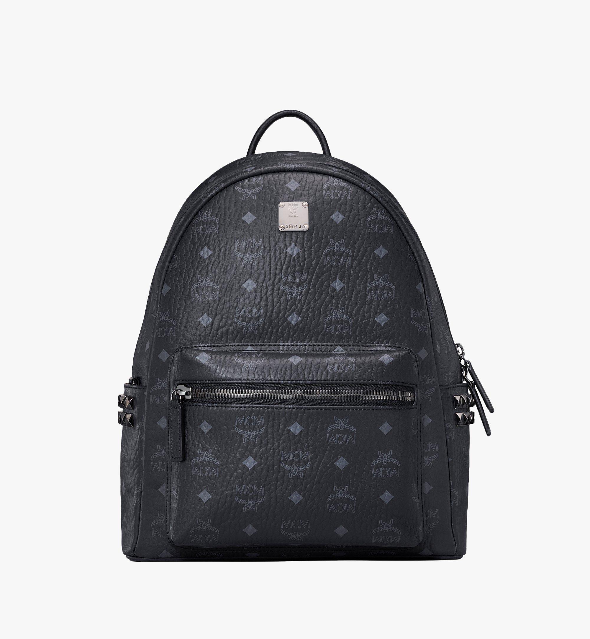 boy rolling book bag