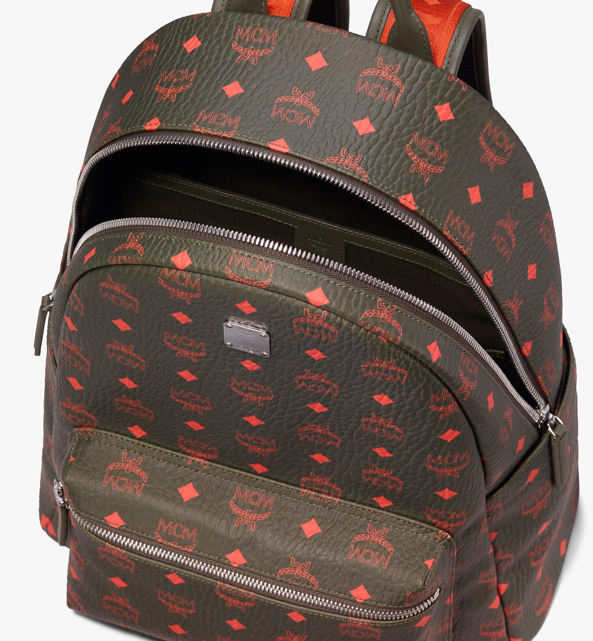 green mcm backpack