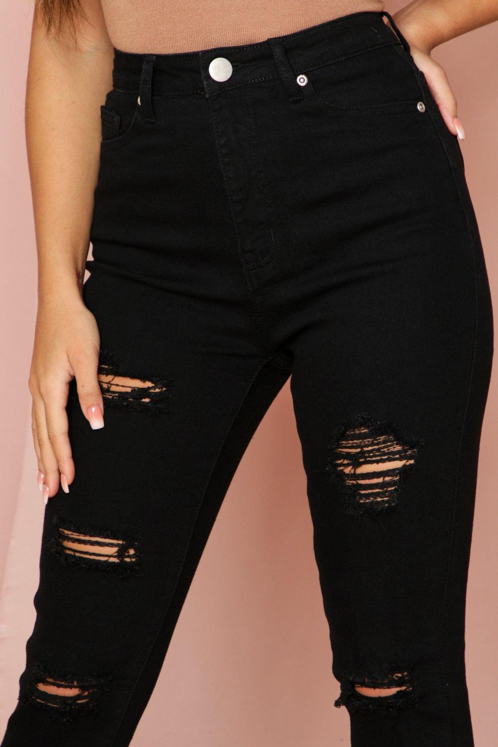 super distressed black skinny jeans