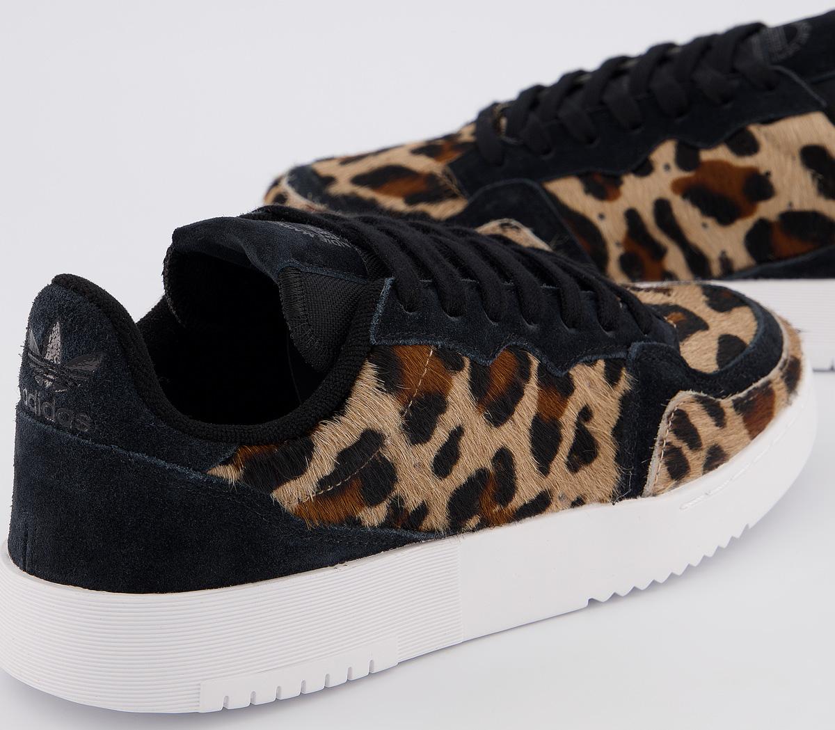 leopard and black trainers