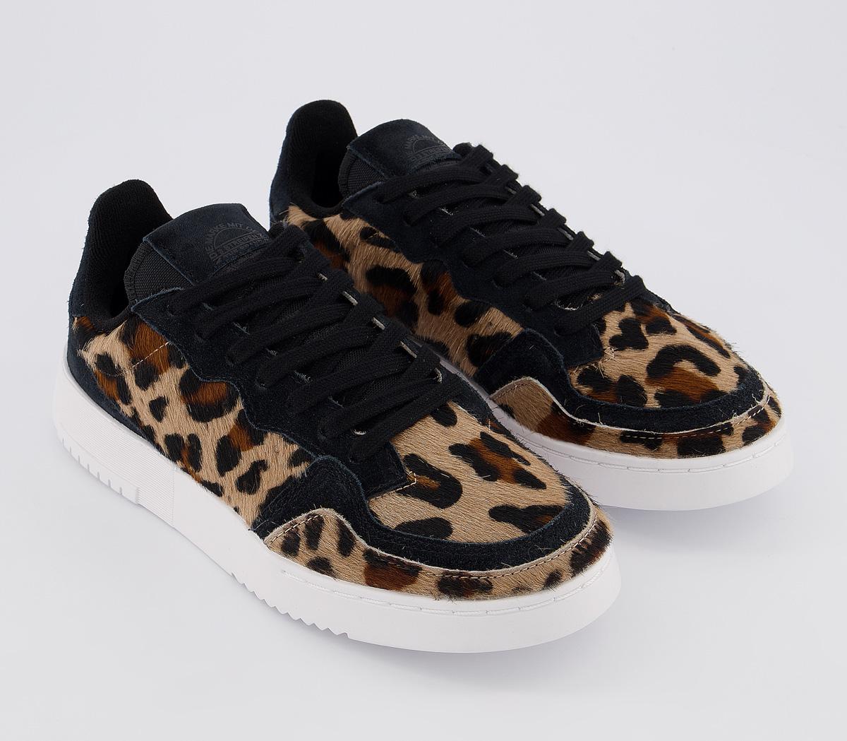 leopard and black trainers