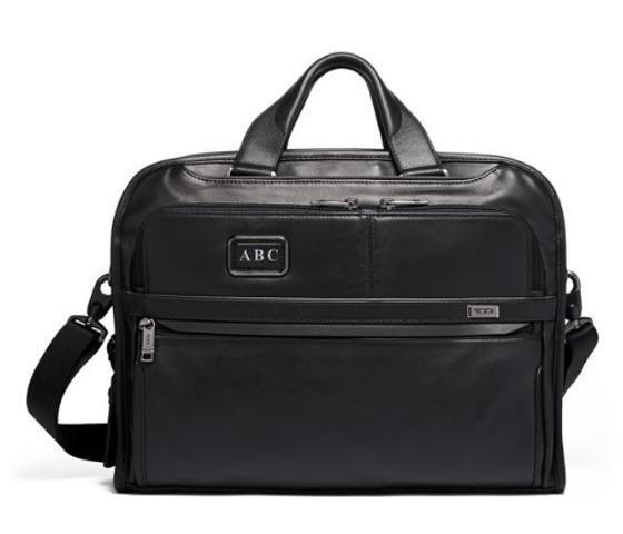 tumi initials on bag