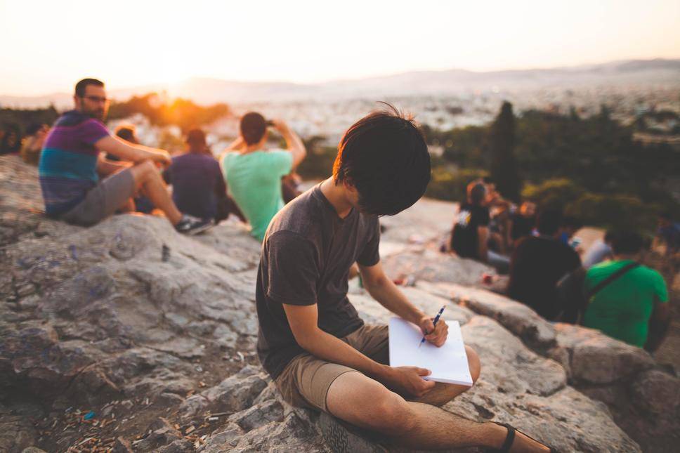 child writing outside