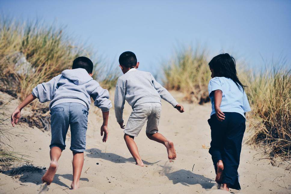 kids running on beach