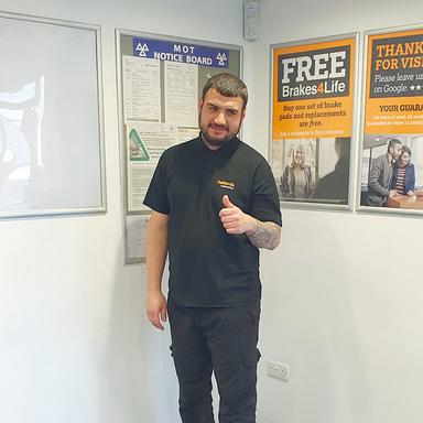 Helping an elderly customer with a MOT