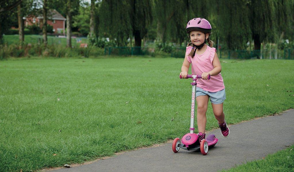 Child on store a scooter