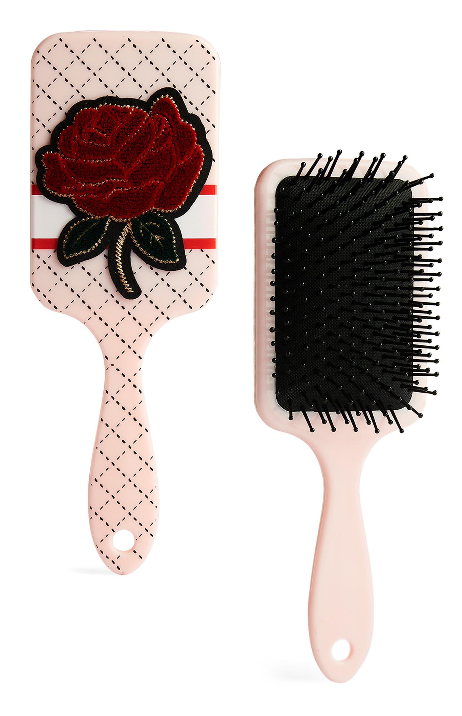 Spazzola piatta con rosa ricamata