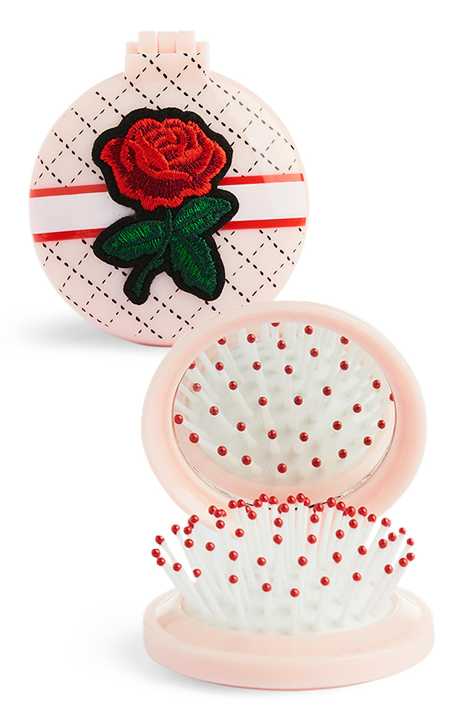 Spazzola compatta con rosa ricamata