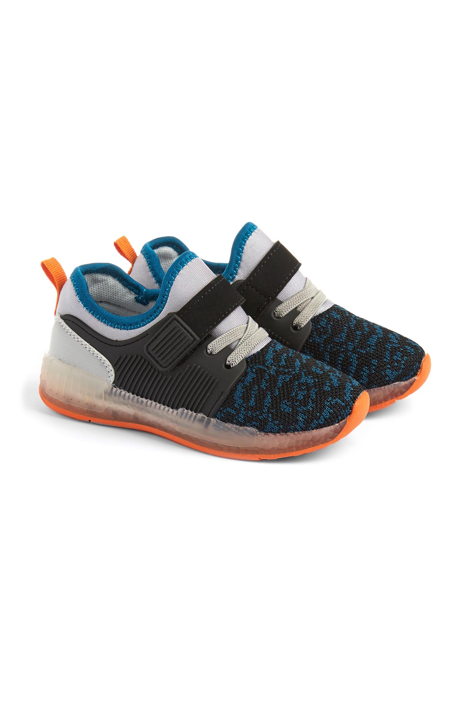 Trainer grigie con luci