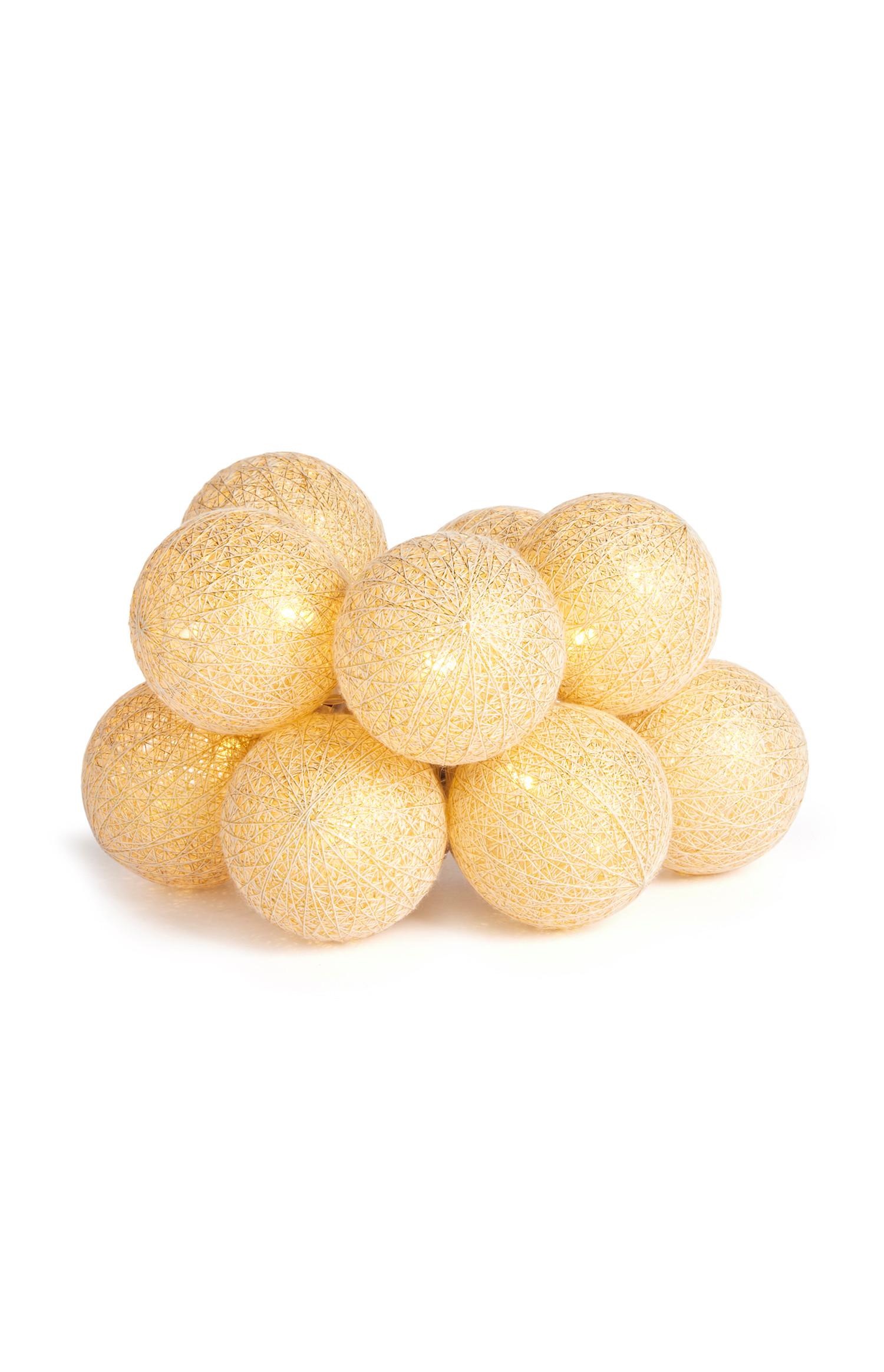 Dieci luci a palla in cotone color panna con filo