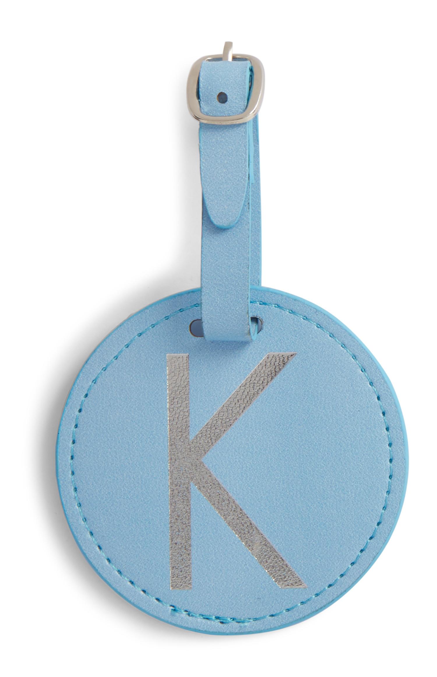 Etichetta bagaglio blu con iniziale