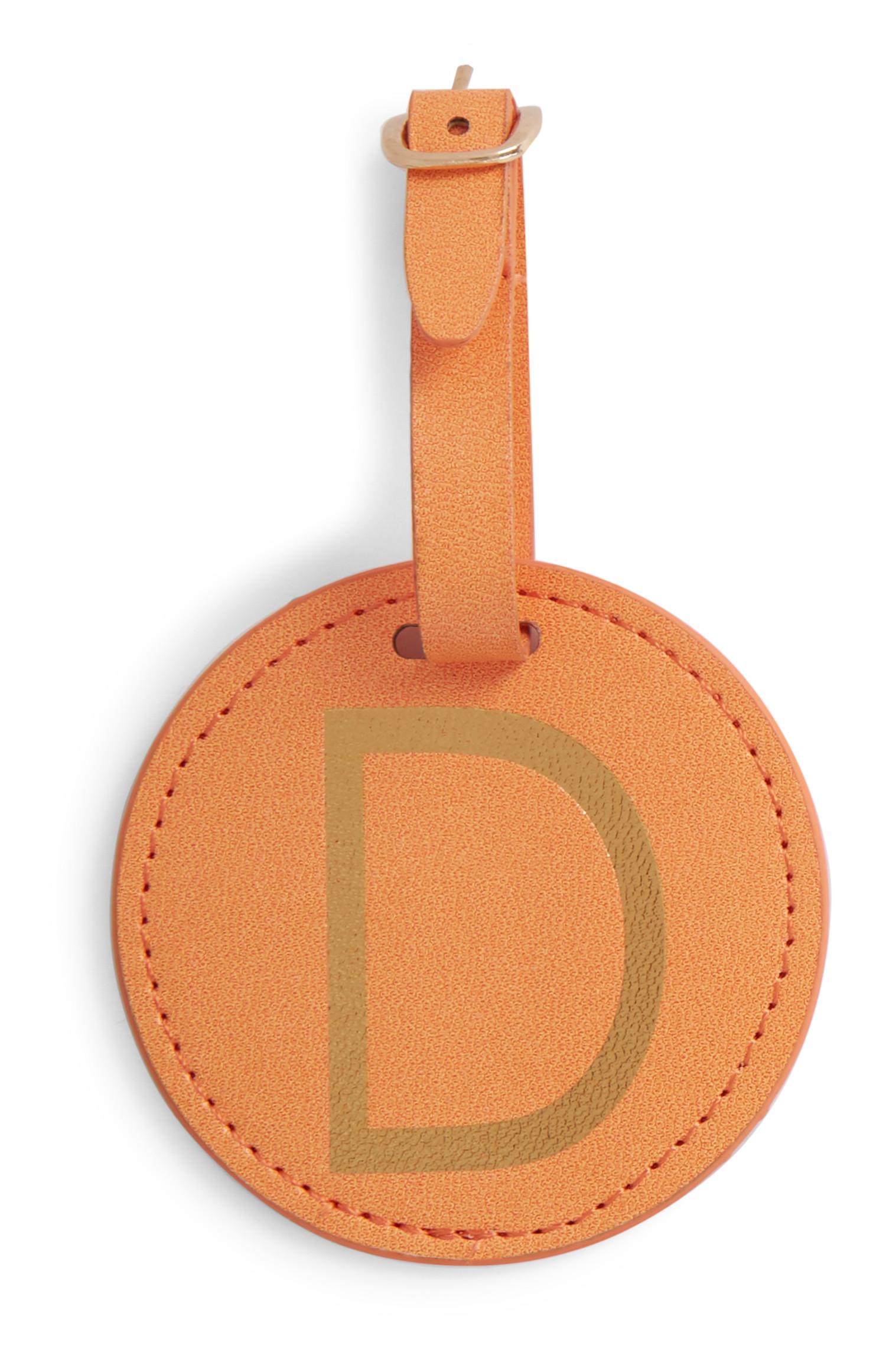 Etichetta bagaglio arancione con iniziale