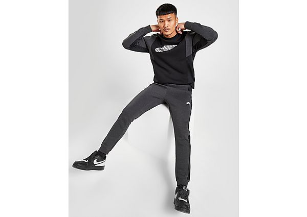 Nike Pantalon hybride en tissu Fleece Nike Sportswear pour Homme - Black Heather/Black/Black/White,