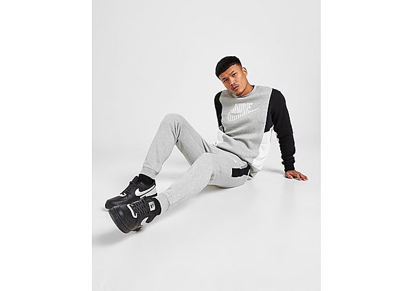 Nike Pantalon hybride en tissu Fleece Nike Sportswear pour Homme - Dark Grey Heather/Black/Dark Grey