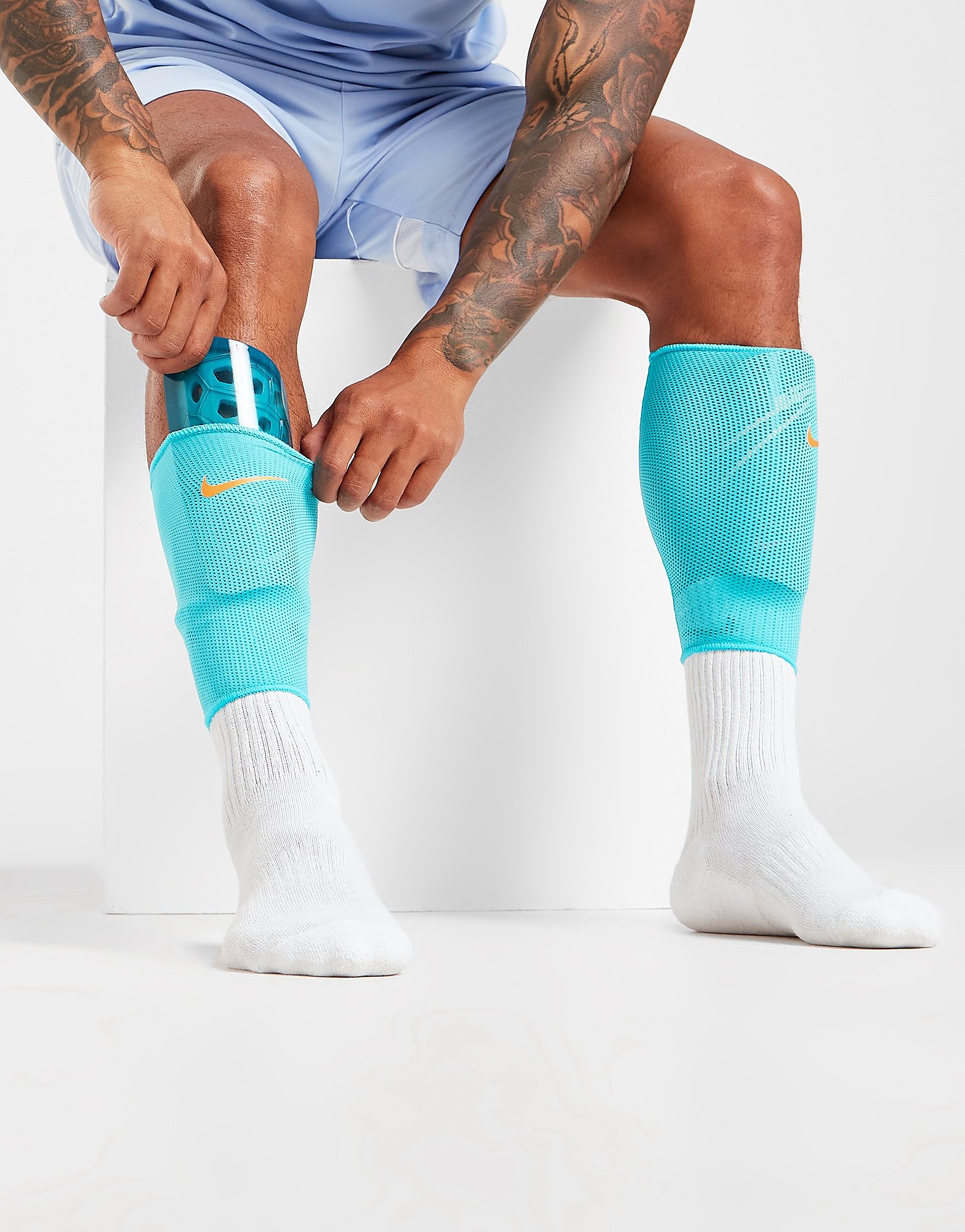

Nike Mercurial Lite Shin Guards - Chlorine Blue/Siren Red/Laser Orange - Womens, Chlorine Blue/Siren Red/Laser Orange
