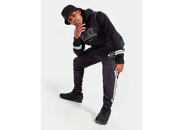 Nike Pantalon en tissu Fleece rétro Nike Sportswear pour Homme - Off-Noir, Off-Noir